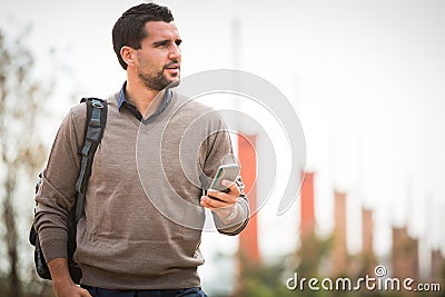 Young man use smartphone urban city Stock Photo