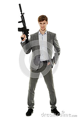 Young man using machine gun Stock Photo