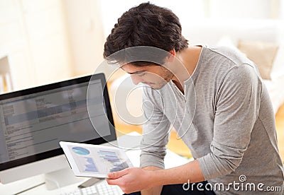 Young man using a tablet at the office Stock Photo