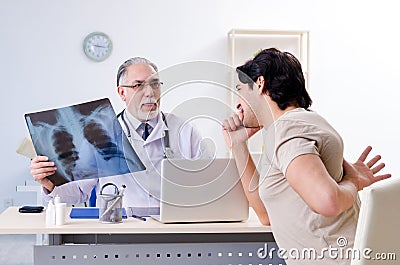 The young man visiting old male doctor radiologist Stock Photo