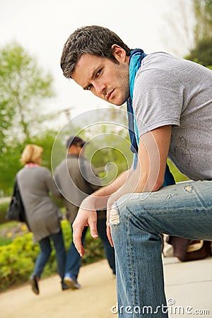 Young man and walking couple Stock Photo