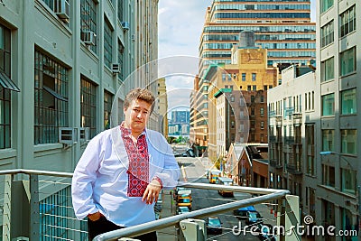 Young man walking in New York in Ukrainian shirt Stock Photo