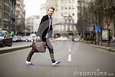 Young man walking on the street Stock Photo