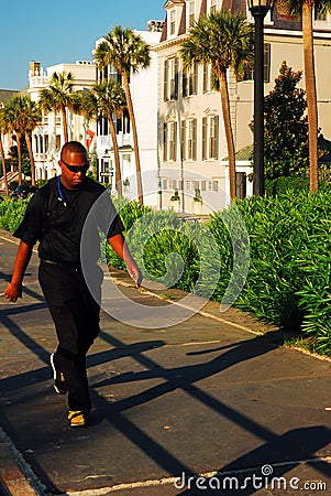 Walking along a path on the Charleston waterfront Editorial Stock Photo