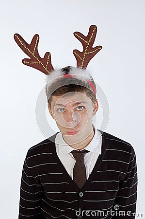 Young man wearing deer's horns Stock Photo