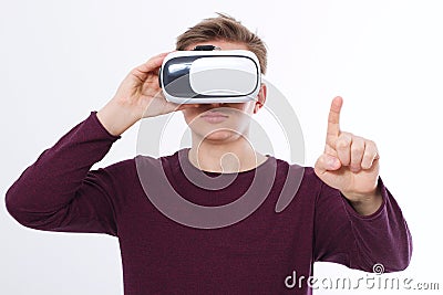 Young Man wearing virtual reality goggles and toch space by finger isolated on white background. VR concept and copy space. Stock Photo