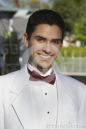 Young Man In White Tuxedo At Quinceanera Stock Photo
