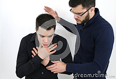 Young man who is choking Stock Photo