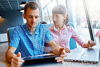 Young man and woman with laptop Stock Photo