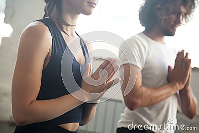 Young man and woman namaste gesture yoga lesson Stock Photo