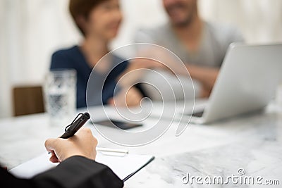 Young man and woman planning with professional consultant. Stock Photo
