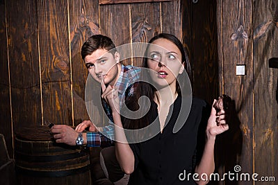 Young man and woman trying to solve a conundrum to get out of th Stock Photo