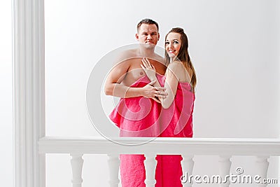 Young man and woman wrapped in towel Stock Photo