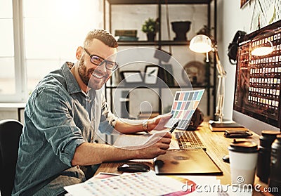 Young man working at computer at workplace Stock Photo