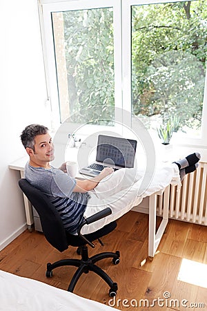 Young man working on laptop Stock Photo