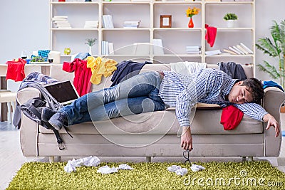 The young man working studying in messy room Stock Photo