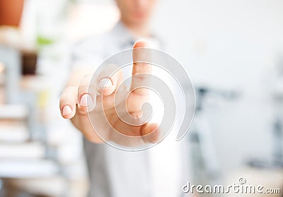 Young man working with virtual screen or pushing button Stock Photo