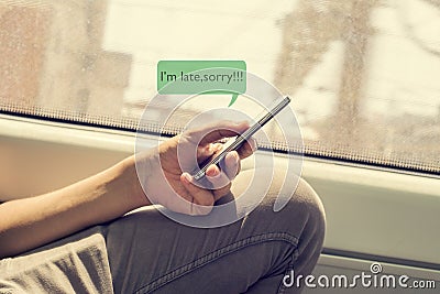 Young man writing a message to apologize Stock Photo