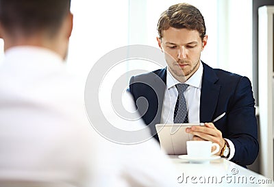 Young manager listening to his colleague Stock Photo