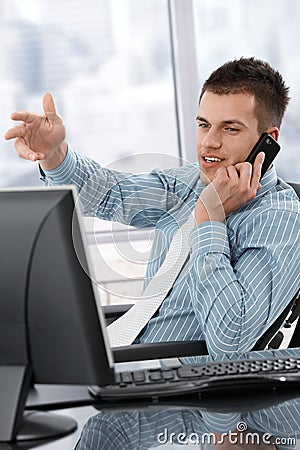 Young manager on mobile phone Stock Photo