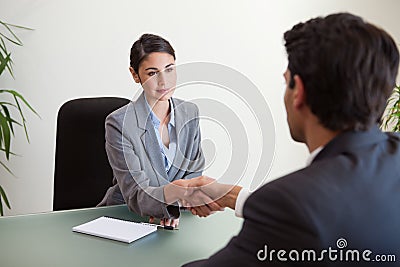 Young manager shaking the hand of a customer Stock Photo