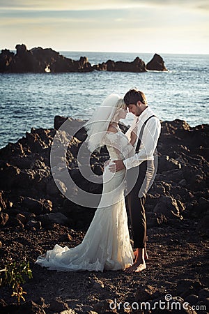 Young marriage couple over the ocean Stock Photo