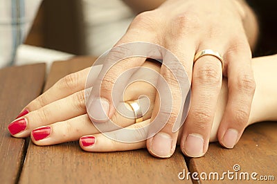 Young Married Couple Holding Hands Closeup Stock Photo