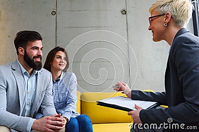 Young married couple with real estate agent Stock Photo