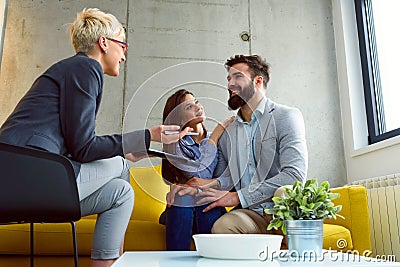 Young married couple at their financial advisor Stock Photo