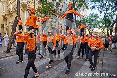 Young members of moixiganga group forming human tower on the street festival in Valencia Editorial Stock Photo