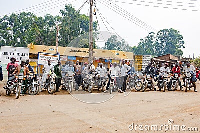 Motorbike rider, motorcyclists ready for taxi journey in Uganda Editorial Stock Photo