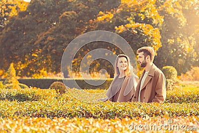 Young couple walk in the autumn park Stock Photo