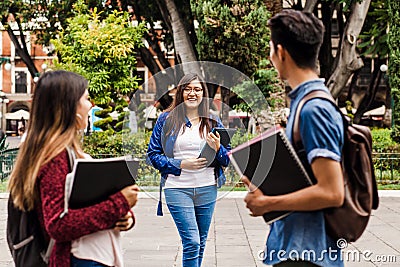 Young mexican woman in group of Latin students in university in Latin America Stock Photo