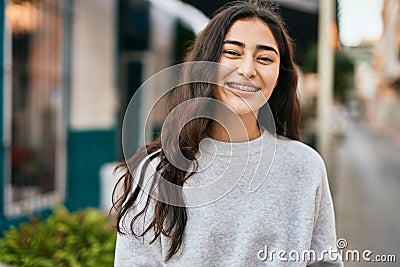 Young middle east girl smiling happy standing at the city Stock Photo