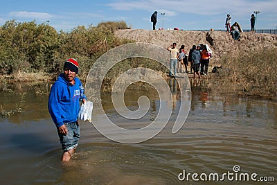 Young migrants crossing the border Editorial Stock Photo