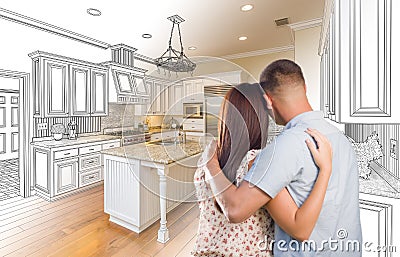 Young Military Couple Inside Custom Kitchen and Design Drawing C Stock Photo