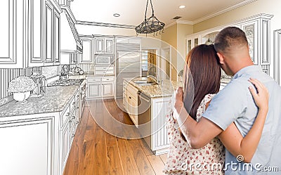 Young Military Couple Inside Custom Kitchen and Design Drawing C Stock Photo