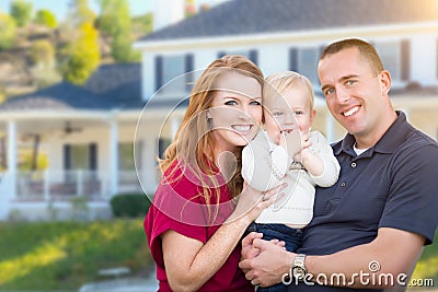 Young Military Family in Front of Their House Stock Photo