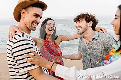Young millennial friends laughing together enjoying summer vacation at the beach Stock Photo