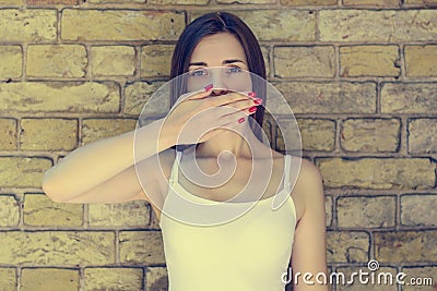 Young minded sad and thoughtful woman in white t-shirt covering Stock Photo