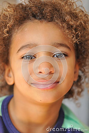 Young mixed race boy with curly hair Stock Photo