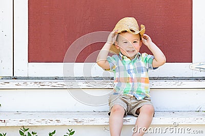 Young Mixed Race Chinese Boy Wearing Cowboy Hat Stock Photo
