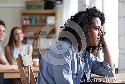 Young mixed race girl suffering from racial discrimination. Stock Photo