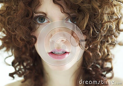 Young mixed woman with curly dark hair Stock Photo