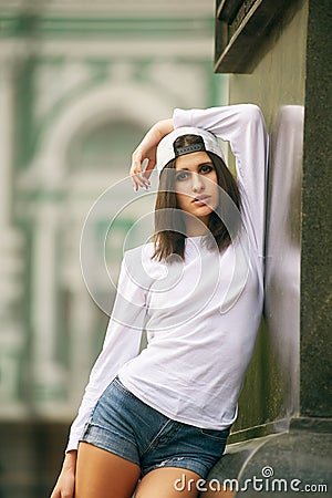Young model girl posing in the city Stock Photo