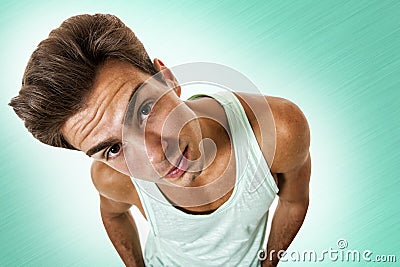 Young model man looking with curiosity from the top isolated Stock Photo