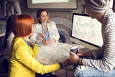 Female graphics designers working together in studio Stock Photo
