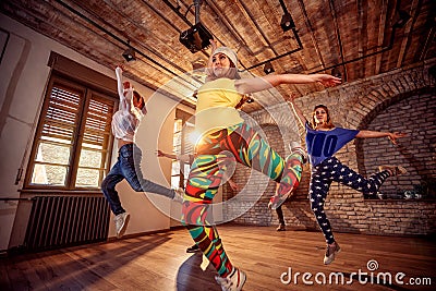 Modern hip hop dancing girls in urban fitness center Stock Photo