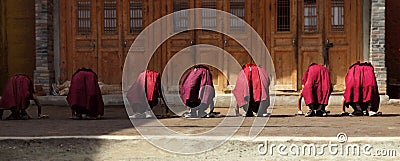 Young monks doing exercice Editorial Stock Photo