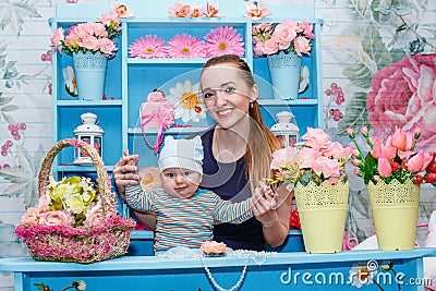 Young mother with baby in her arms Stock Photo